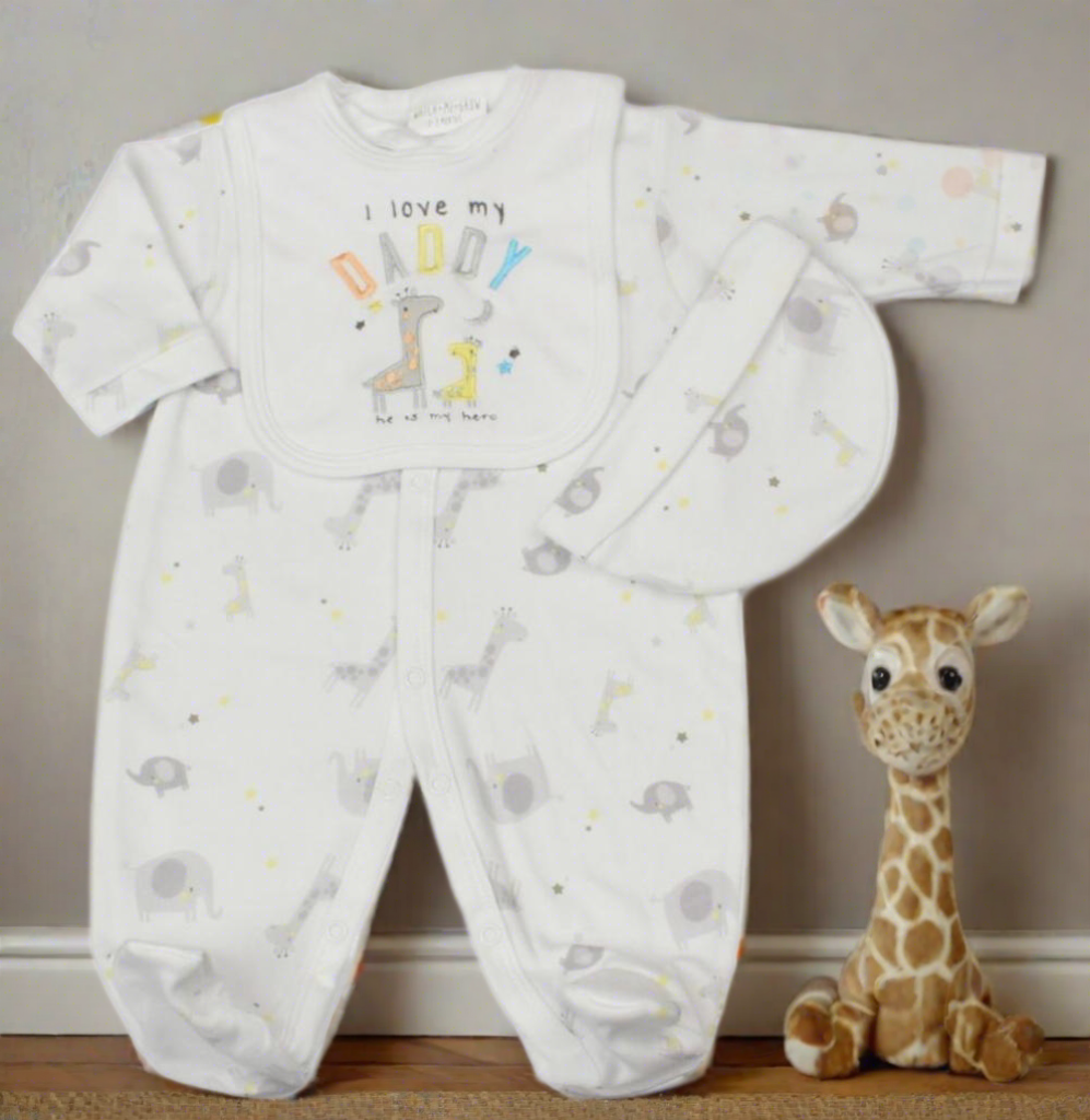 Unisex baby clothes set - Image of white three-piece baby clothes set with giraffe theme, featuring 'I Love My Daddy' embroidery. Includes bib, hat and sleepsuit. (Front Angle with giraffe plush)
