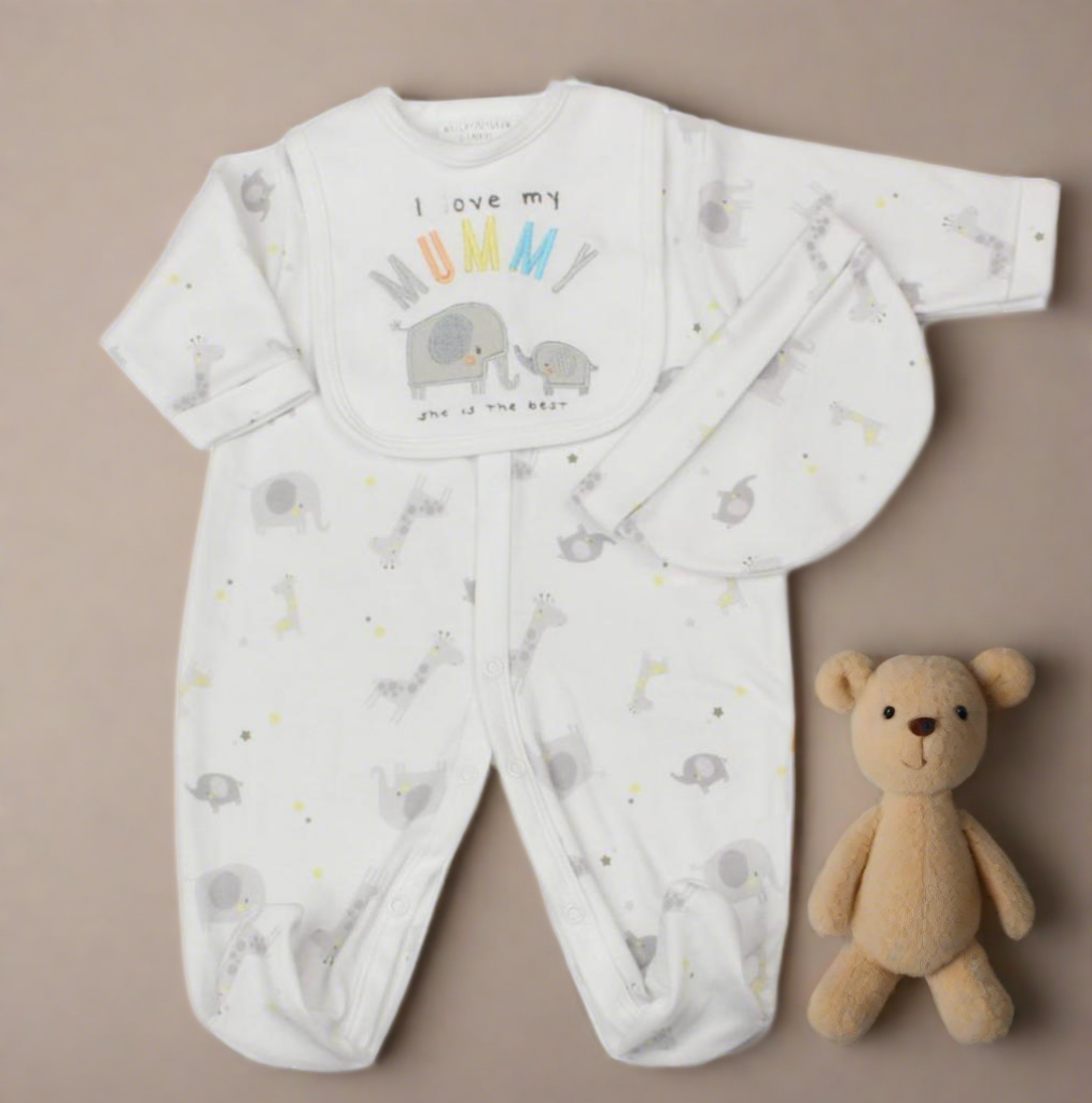 Unisex baby clothes set - Image of white three-piece baby clothes set with elephant theme, featuring 'I Love My Mummy' embroidery. Includes bib, hat and sleepsuit. (Front Angle on a neutral beige background with teddy bear used for advertising only)