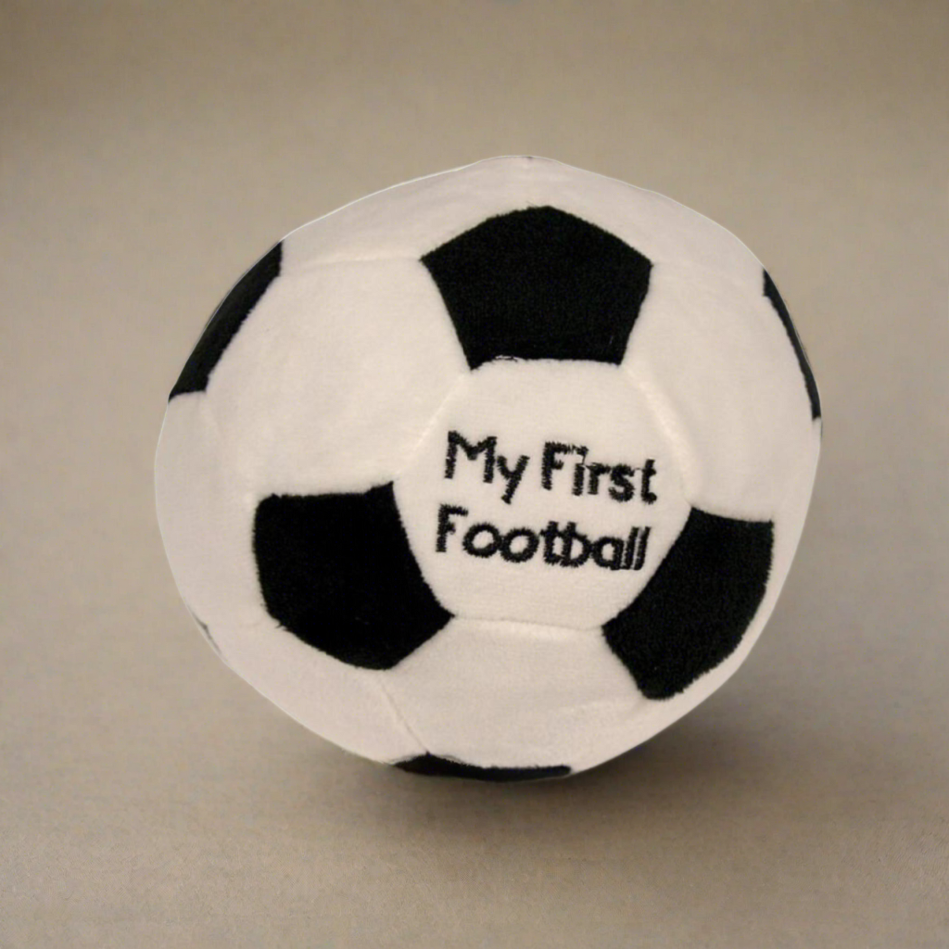 Soft baby toy, my first football. Measuring 15cm made from soft plush materials with a rattle sound within. (Black and white football)
