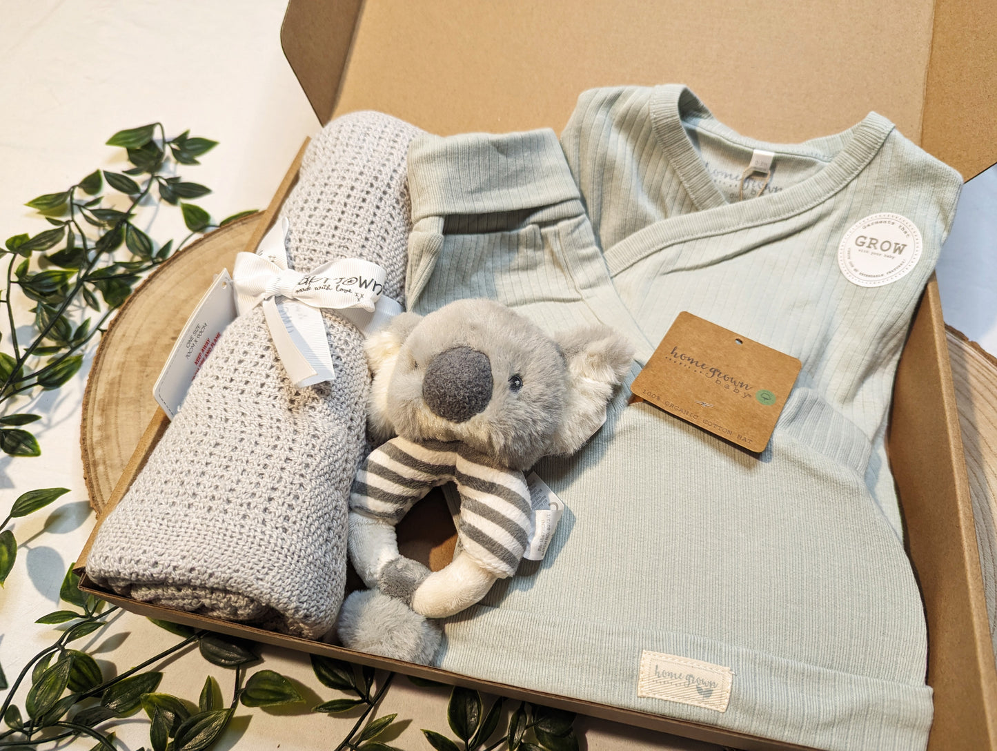 100% cotton grey cellular baby blanket featued in an example of a gift bundle featuring other baby products available at LoobyLu Baby 