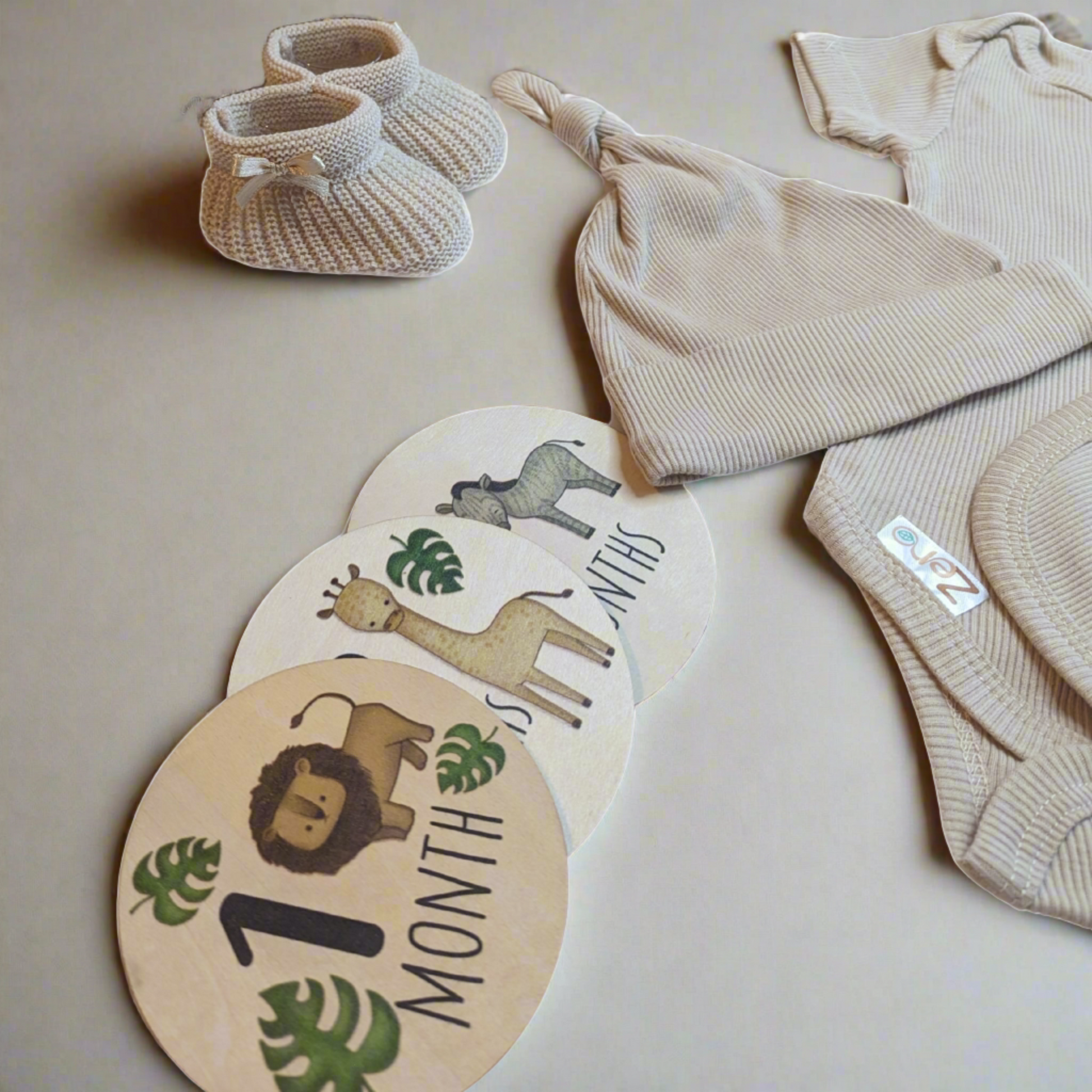 Complete mummy to be gift hamper with hessian bag, milestone discs, eco-friendly baby clothes, and baby booties
